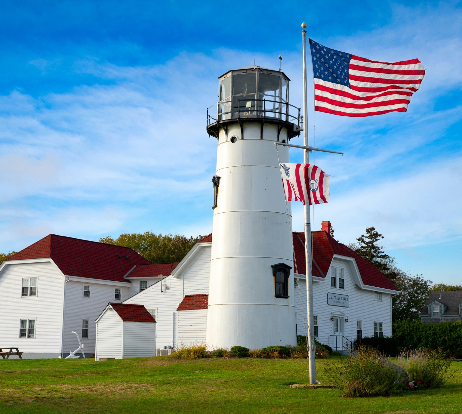 Cape Cod Coast Guard lighthouse with American flag